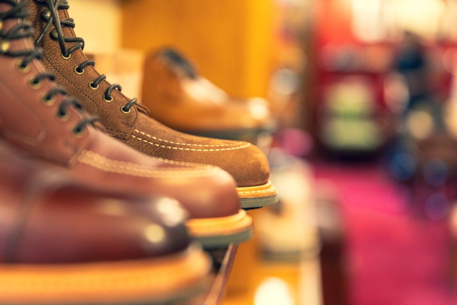Stylish leather boots on a shelf, showcasing craftsmanship in a shoe store.